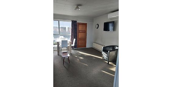 spacious living area of two-bedroom access unit